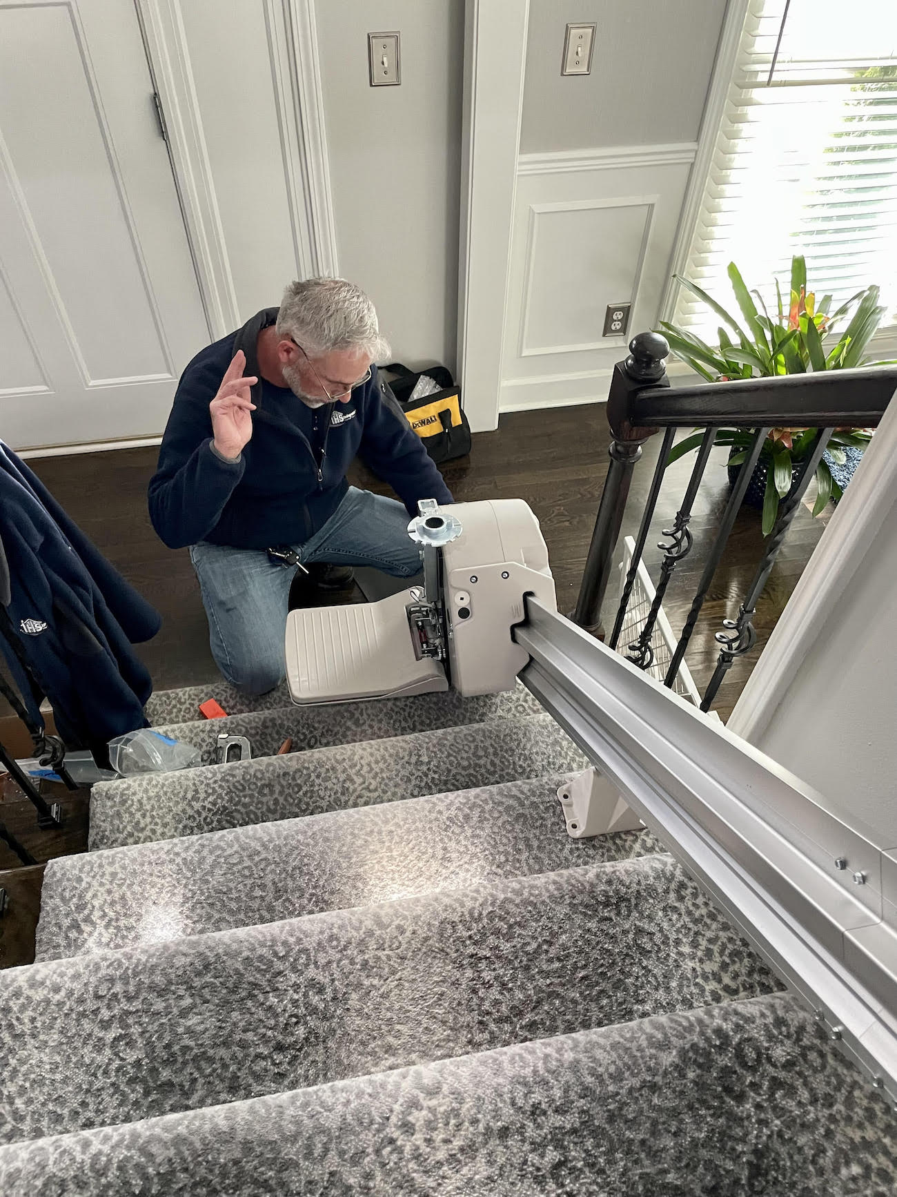 man installing a stair lift