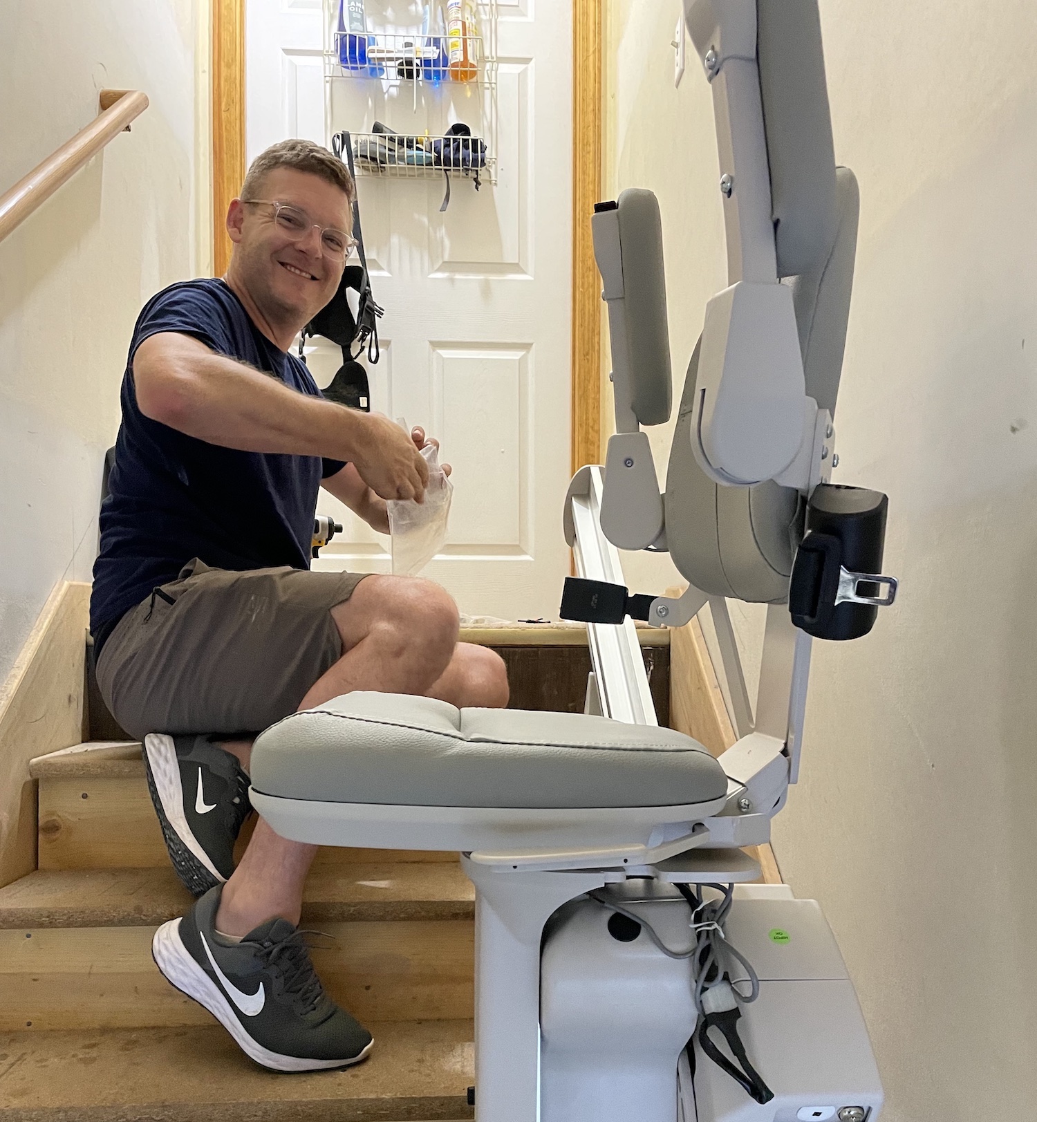 man working on a stair lift